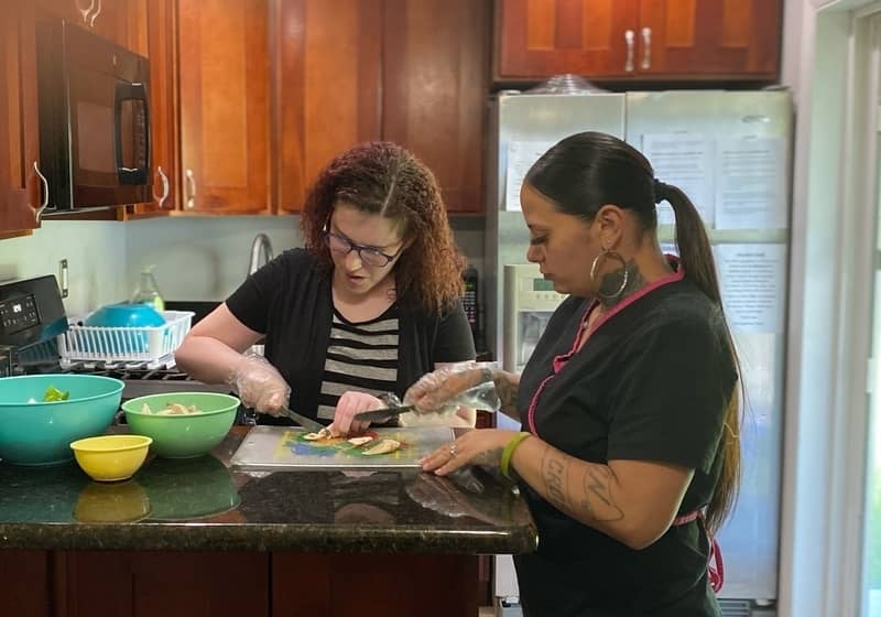 lifegroup's staff indoor cooking and have fun with an intellectual disabilities girl