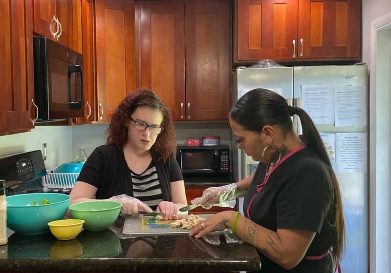 lifegroup's staff indoor cooking and have fun with an intellectual disabilities girl