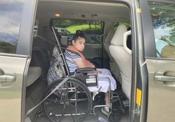 an intellectual disabilities women sitting in a car